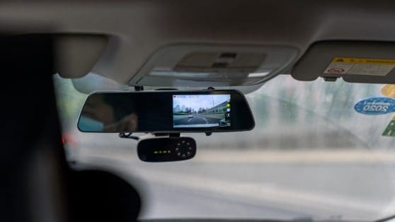 small dash cam on windshield