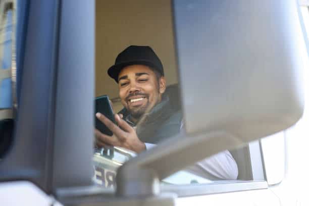 smiling driver with phone