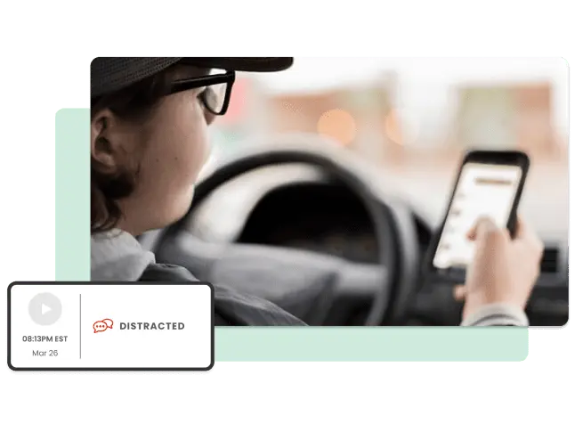 Woman driving and looking at phone. Promote a safe driving program with Netradyne